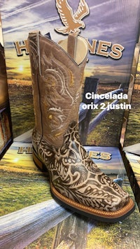 a pair of cowboy boots in a box